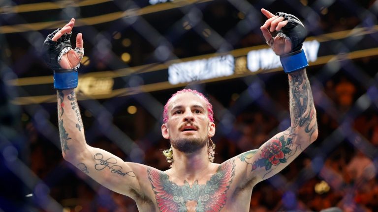 Sean O'Malley celebrates after his UFC 292 Bantamweight title mixed martial arts fight, Saturday, August 19, 2023, in Boston. O'Malley won the title via 2nd round KO. (Gregory Payan/AP Photo).