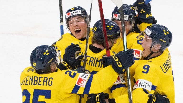 Sweden's Jonathan Lekkerimaki (23) celebrates his second goal over Czechia with teammates Otto Stenberg (25), Noah Ostlund (12), Tom Willander (24) and Theo Lindstein (9) during third period semifinal hockey action at the IIHF World Junior Hockey Championship in Gothenburg, Sweden, Thursday Jan. 4, 2024. (Christinne Muschi/CP)