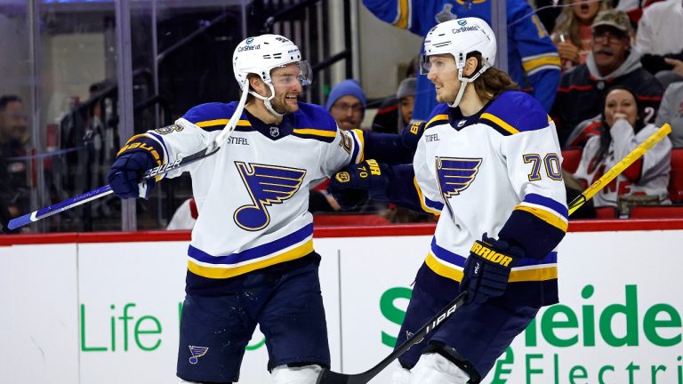 St. Louis Blues' Nathan Walker (23) celebrates his goal against the Carolina Hurricanes with Oskar Sundqvist (70) during the first period of an NHL hockey game in Raleigh, N.C., Saturday, Jan. 6, 2024. (Karl B DeBlaker/AP Photo)