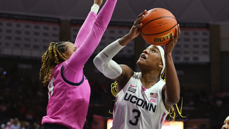 UConn forward Aaliyah Edwards (3) shoots against St. John's forward Jillian Archer, left, in the second half of an NCAA college basketball game in Storrs, Conn., Sunday, Feb. 4, 2024. (Cloe Poisson/Hartford Courant via AP)