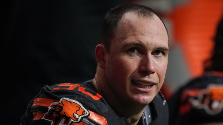 B.C. Lions defensive lineman Mathieu Betts sits on the bench during the second half of a CFL football game against the Calgary Stampeders, in Vancouver, on Friday, October 20, 2023. Betts recorded his 18th sack of the season to set a new single-season sack record by a Canadian. (Darryl Dyck/CP)