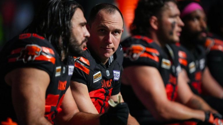 B.C. Lions defensive lineman Mathieu Betts talks with David Menard as they sit on the bench after the third quarter of a CFL football game against the Calgary Stampeders, in Vancouver, B.C., Friday, Oct. 20, 2023. (Darryl Dyck/CP Photo)
