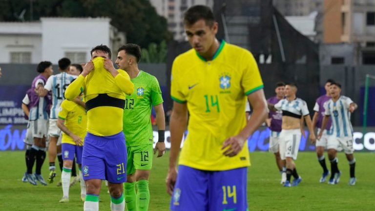 Brazil's players react after losing against Argentina in the last game of the South America's under-23 pre-Olympic soccer tournament at Brigido Iriarte stadium in Caracas, Venezuela, Sunday, Feb. 11, 2024. (Ariana Cubillos/AP Photo)