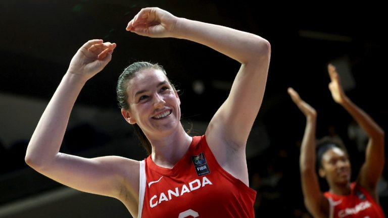 Bridget Carleton of Canada celebrates after her team won the women's basketball Olympic qualifying tournament first round match between Hungary and Canada in Sopron, Hungary, Thursday, Feb. 8, 2024. (Zsombor Toth/MTI via AP)