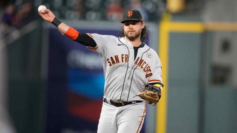 San Francisco Giants shortstop Brandon Crawford throws to first base to put out Colorado Rockies' Brendan Rodgers during the third inning of a baseball game Friday, Sept. 15, 2023, in Denver. (David Zalubowski/AP)