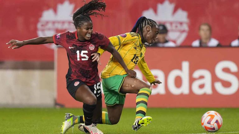 Canada's Nichelle Prince, left, battles Jamaica's Tiffany Cameron for the ball during first half CONCACAF women's championship soccer series match in Toronto on Tuesday Sept. 26, 2023. (Nathan Denette/CP)