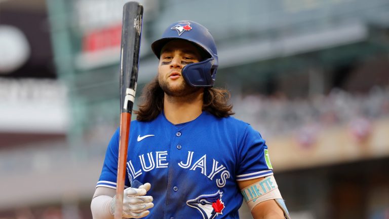 Toronto Blue Jays' Bo Bichette walks to the dugout after striking out against the Minnesota Twins during the sixth inning of Game 2 of an AL wild-card baseball playoff series Wednesday, Oct. 4, 2023, in Minneapolis. (AP Photo/Bruce Kluckhohn) 