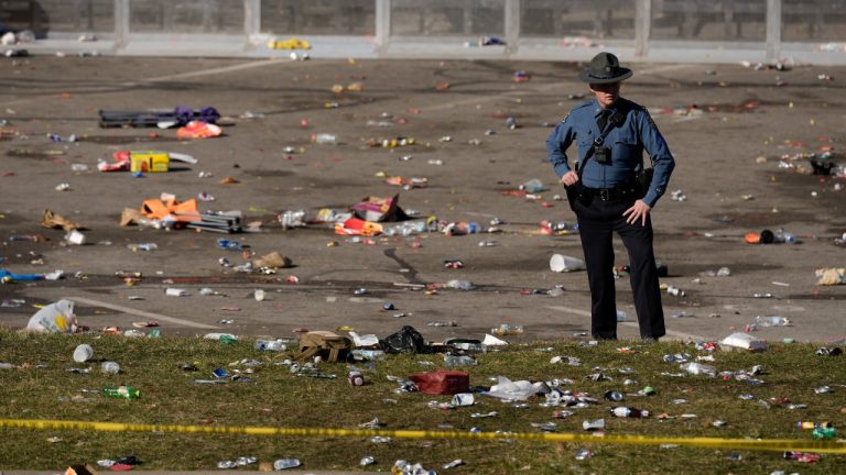 A law enforcement officer looks around the scene following a shooting at the Kansas City Chiefs NFL football Super Bowl celebration in Kansas City, Mo., Wednesday, Feb. 14, 2024. Multiple people were injured, a fire official said. (AP)