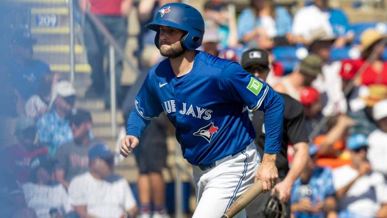 Toronto Blue Jays pitcher Tim Mayza plays bat boy in opening day Spring Training action against the Philadelphia Phillies in Dunedin, Fla. on Saturday February 24, 2024. Mayza came last in a fantasy football pool with teammates. (Frank Gunn/CP)