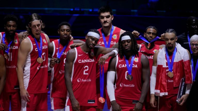 Canada players pose for a photo after the Basketball World Cup bronze medal game between the United States and Canada in Manila, Philippines, Sunday, Sept. 10, 2023. (Michael Conroy/AP Photo)