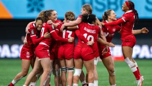 Canada's Charity Williams, right, jumps to join her teammates as they celebrate defeating the United States in Vancouver Sevens women's rugby action, in Vancouver, on Saturday, Feb. 24, 2024. (Ethan Cairns/CP)