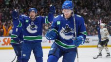 Canucks stick with it, snap losing streak with &#8216;big character win&#8217; over Bruins