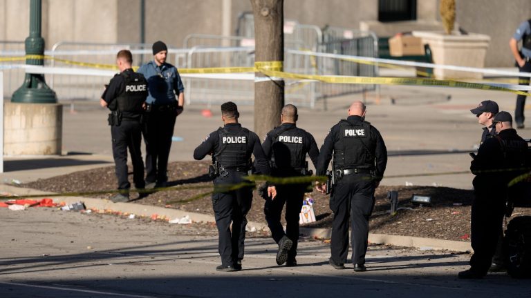 Law enforcement officers look around the scene after an incident following the Kansas City Chiefs victory parade in Kansas City, Mo., Wednesday, Feb. 14, 2024. The Chiefs defeated the San Francisco 49ers Sunday in the NFL Super Bowl 58 football game. (Charlie Riedel/AP)