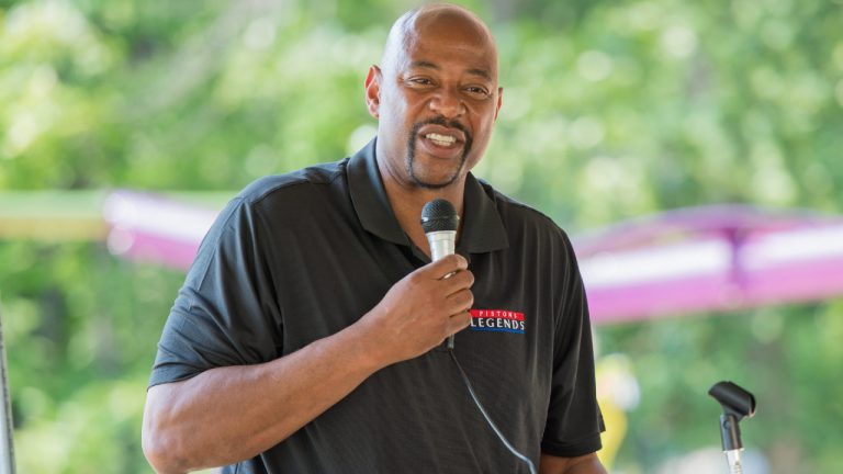 In this photo taken on Tuesday, July 22, 2014, former Detroit Pistons player Earl Cureton speaks during the Camp Fish Tales playground dedication in Pinconning, Mich. (AP Photo/The Bay City Times, Amanda Ray)