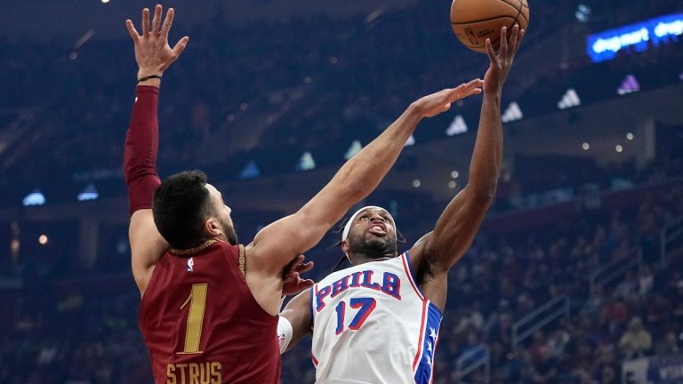 Philadelphia 76ers guard Buddy Hield shoots in front of Cleveland Cavaliers guard Max Strus in the first half of an NBA basketball game, Monday, Feb. 12, 2024, in Cleveland. (Sue Ogrocki/AP Photo)