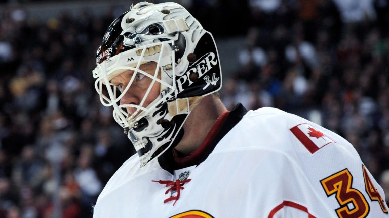 Calgary Flames goalie Miikka Kiprusoff, from Finland, pauses during the third period of an NHL hockey game against the Colorado Avalanche on Tuesday, March 20, 2012, in Denver. The Avalanche won 2-1 in overtime. (Jack Dempsey/AP)