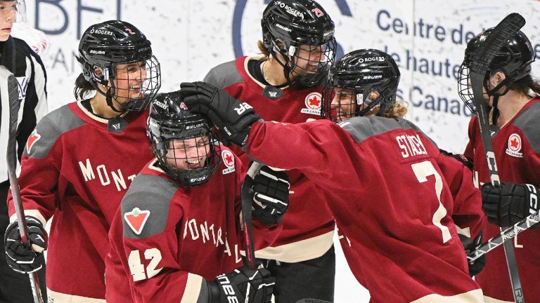 Montreal's Claire Dalton (42) celebrates with teammates after scoring against Ottawa during third period PWHL hockey action in Montreal, Saturday, February 24, 2024. (Graham Hughes/CP)