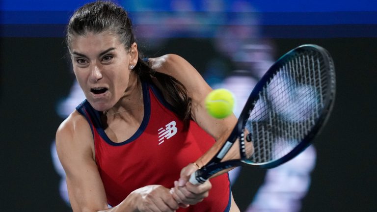 Sorana Cirstea of Romania returns the ball to Sofia Kenin of the U.S. during a match of the Dubai Duty Free Tennis Championships in Dubai, United Arab Emirates, Sunday, Feb. 18, 2024. (Kamran Jebreili/AP)