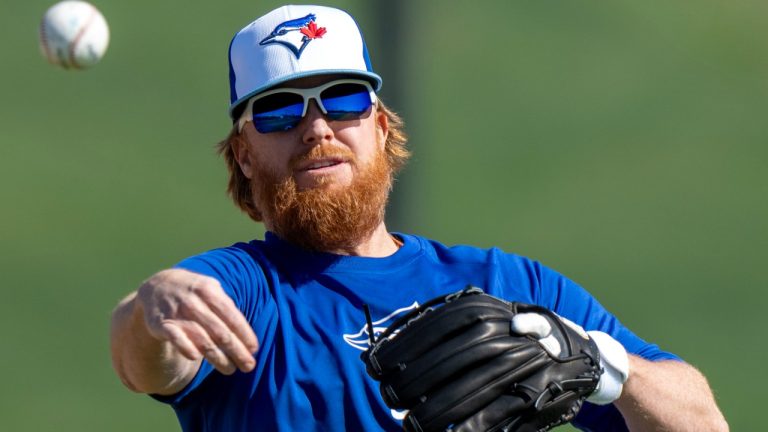 Toronto Blue Jays Justin Turner throws a ball in a drill during spring training action in Dunedin, Fla. on Feb. 19, 2024. (CP)