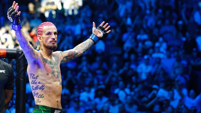 Sean O'Malley acknowledges the fans before his UFC 292 bantamweight title fight where he won the title via 2nd round KO. (Gregory Payan/AP).