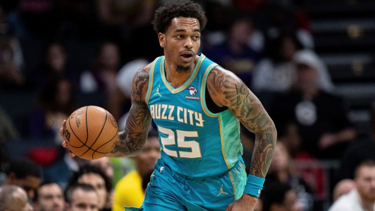 Charlotte Hornets forward P.J. Washington brings the ball up court during the first half of an NBA basketball game against the Los Angeles Lakers, Monday, Feb. 5, 2024, in Charlotte, N.C. (Jacob Kupferman/AP)