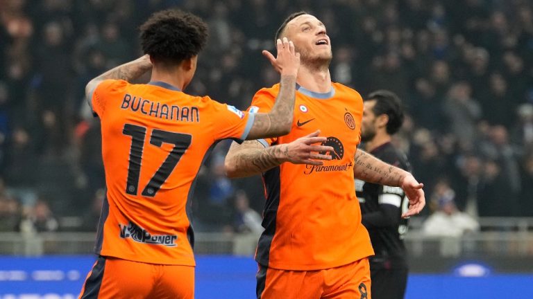 Inter Milan's Marko Arnautovic, right, celebrates with his teammate Tajon Buchanan after scoring his side's fourth goal during the Serie A soccer match between Inter Milan and Salernitana at the San Siro stadium in Milan, Italy, Friday, Feb.16, 2023. (Luca Bruno/AP)