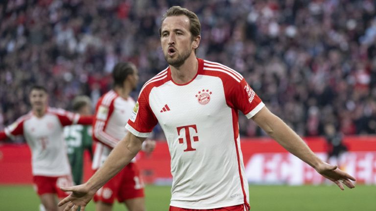 Bayern Munich's Harry Kane celebrates scoring his side's second goal during the German Bundesliga soccer match between Bayern Munich and Borussia Moenchengladbach, at the Allianz Arena in Munich, Germany, Saturday, Feb. 3, 2024. (Sven Hopper/dpa via AP)