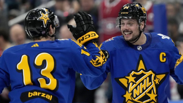 NHL All-Star Team Matthews Captain, forward Auston Matthews (34), of the Toronto Maple Leafs, and teammate Mathew Barzal (13), of the New York Islanders, celebrate winning the game via shootout with Team Hughes, during the NHL All-Star Game, in Toronto, Saturday, Feb. 3, 2024. (Frank Gunn/CP)