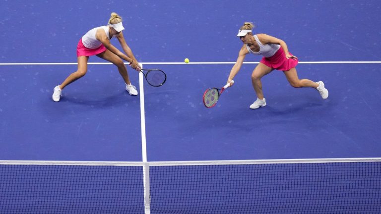 Gabriela Dabrowski, of Canada, right, returns a shot alongside doubles partner Erin Routliffe, of New Zealand, left, during the women's doubles final of the U.S. Open tennis championships against Laura Siegemund, of Germany, and Vera Zvonareva, of Russia, Sunday, Sept. 10, 2023, in New York. (Manu Fernandez/AP)