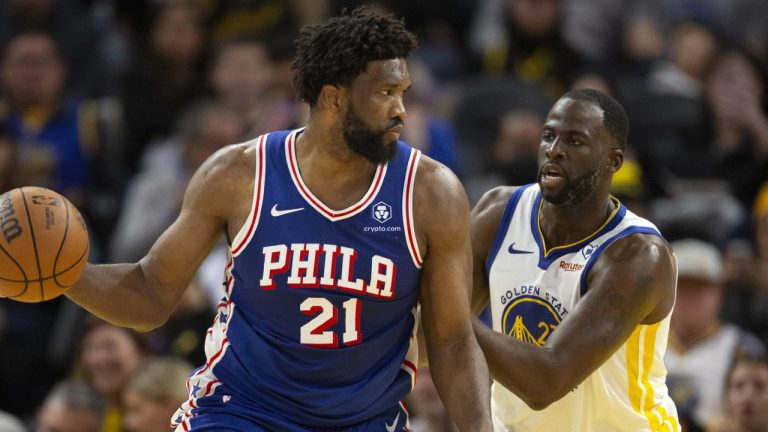 Philadelphia 76ers centre Joel Embiid (21) looks to pass around Golden State Warriors forward Draymond Green (23) during the second half of an NBA basketball game, Tuesday, Jan. 30, 2024, in San Francisco. (D. Ross Cameron/AP)