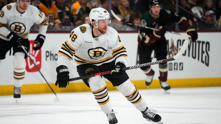 Boston Bruins defenceman Matt Grzelcyk skates to the puck against the Arizona Coyotes during the first period of an NHL hockey game Tuesday, Jan. 9, 2024, in Tempe, Ariz. (Ross D. Franklin/AP)