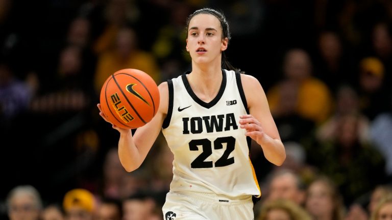 Iowa guard Caitlin Clark (22) drives up court during the first half of an NCAA college basketball game against Penn State, Thursday, Feb. 8, 2024, in Iowa City, Iowa. (Charlie Neibergall/AP Photo)