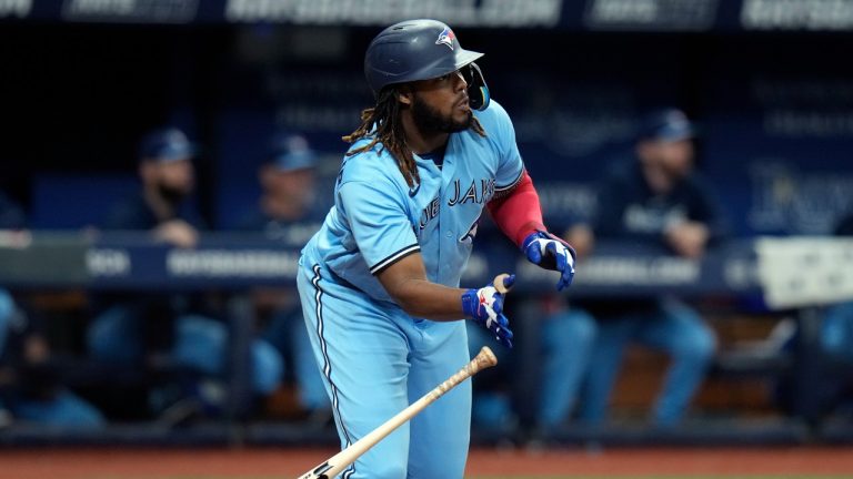 Toronto Blue Jays' Vladimir Guerrero Jr. watches his RBI single off Tampa Bay Rays starting pitcher Shane McClanahan during the fourth inning of a baseball game Wednesday, May 24, 2023, in St. Petersburg, Fla. Toronto's Bo Bichette scored on the hit. (Chris O'Meara/AP)