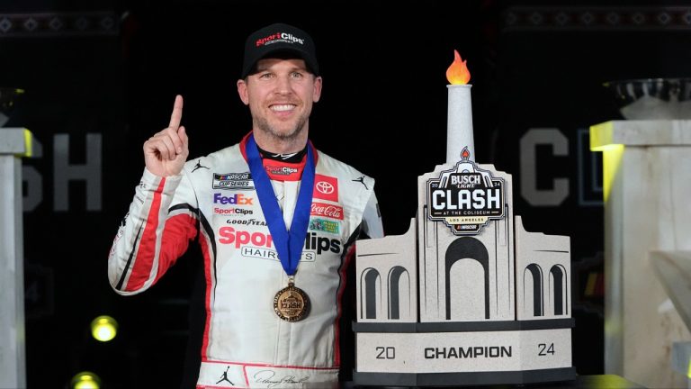 Denny Hamlin poses with his troph after winning the Busch Light Clash NASCAR exhibition auto race at Los Angeles Memorial Coliseum Saturday, Feb. 3, 2024, in Los Angeles. (Mark J. Terrill/AP)