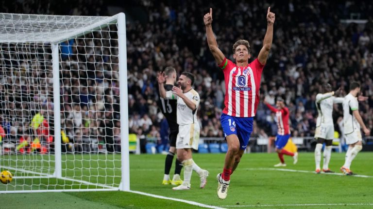 Atletico Madrid's Marcos Llorente celebrates after scoring his side's first goal during the Spanish La Liga soccer match between Real Madrid and Atletico Madrid at the Santiago Bernabeu stadium in Madrid, Spain, Sunday, Feb. 4, 2024. (Bernat Armangue/AP)