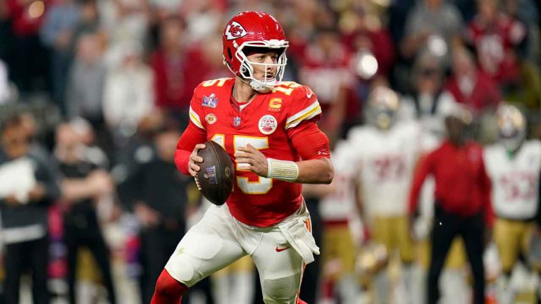 Kansas City Chiefs quarterback Patrick Mahomes (15) rolls out against the San Francisco 49ers during the second half of the NFL Super Bowl 58 football game. (Steve Luciano/AP)