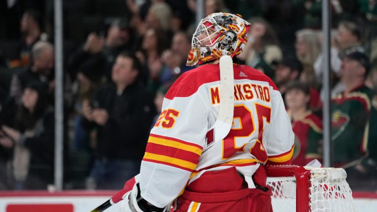 Calgary Flames goaltender Jacob Markstrom (25) looks up at the video board after a goal by Minnesota Wild left wing Pat Maroon during the second period of an NHL hockey game Tuesday, Jan. 2, 2024, in St. Paul, Minn. (Abbie Parr/AP)