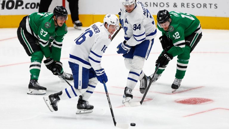 Dallas Stars forwards Mason Marchment (27) and Radek Faksa (12) battle Toronto Maple Leafs forwards Mitchell Marner (16) Auston Matthews (34) for the puck during the third period of an NHL hockey game, Thursday, Oct. 26, 2023, in Dallas. Toronto won 4-1. (Brandon Wade/AP)