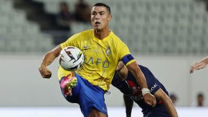 Al Nassr's Cristiano Ronaldo controls the ball during a friendly soccer match against Paris Saint-Germain in Osaka, western Japan, Tuesday, July 25, 2023. (Kyodo News via AP)