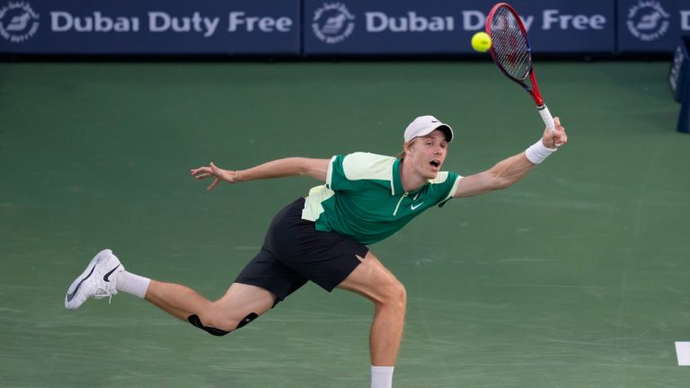 Denis Shapovalov of Canada returns the ball to Andy Murray of Great Britain during a match of the Dubai Duty Free Tennis Championships in Dubai, United Arab Emirates, Monday, Feb. 26, 2024. (Kamran Jebreili/AP)