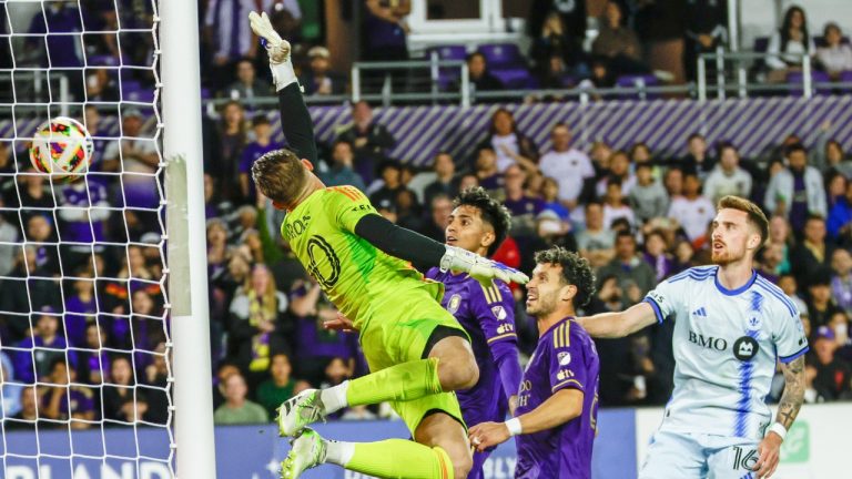 Orlando City midfielder Mauricio Pereyra, center left, Orlando City midfielder Felipe Martins, center right, and CF Montréal defender Joel Waterman, right, watch as CF Montréal goalkeeper Jonathan Sirois, left, dives for the ball during the second half of an MLS soccer match Saturday, Feb. 24, 2024, in Orlando, Fla. (Kevin Kolczynski/AP)