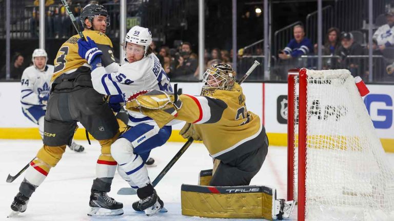 Vegas Golden Knights defenseman Brayden McNabb (3) and Toronto Maple Leafs left wing Tyler Bertuzzi (59) watch as Golden Knights goaltender Adin Hill (33) makes a save during the first period of an NHL hockey game. (Ian Maule/AP)