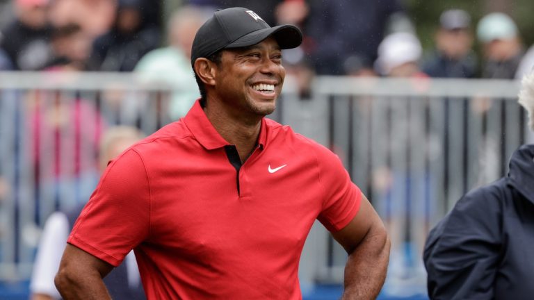 Tiger Woods smiles on first tee during the final round of the PNC Championship golf tournament Sunday, Dec. 17, 2023, in Orlando, Fla. (Kevin Kolczynski/AP)