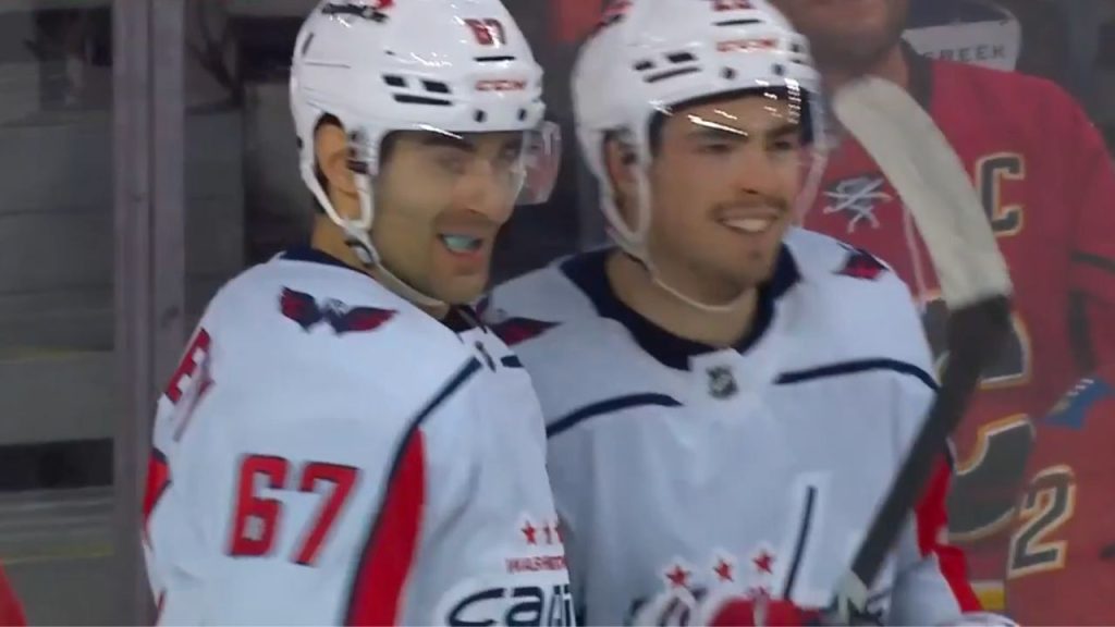 Capitals Lapierre bats one timer off backhand pass from Milano