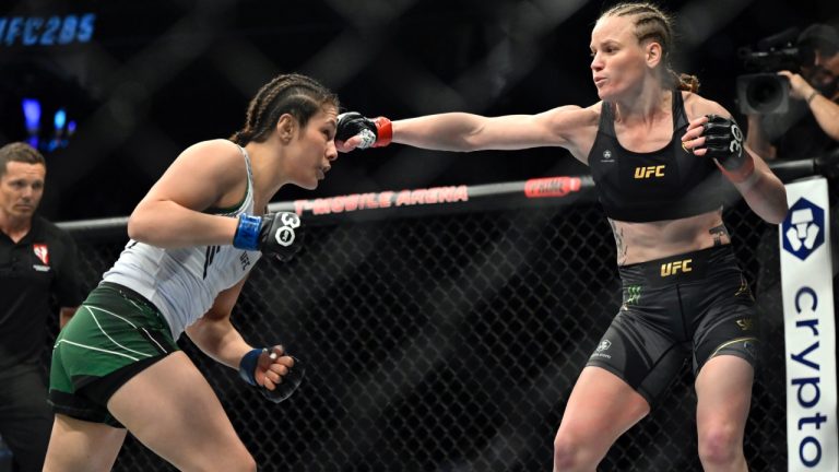 Valentina Shevchenko throws a right at Alexa Grasso, left, during a UFC 285 mixed martial arts flyweight title bout. (David Becker/AP)