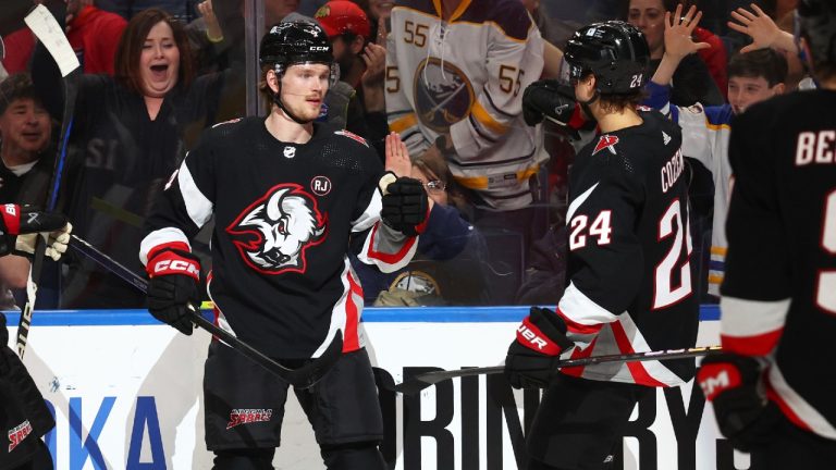 Buffalo Sabres defenseman Bowen Byram (4) celebrates his goal with center Dylan Cozens (24) during the first period of an NHL hockey game against the Detroit Red Wings Tuesday, March 12, 2024, in Buffalo, N.Y. (Jeffrey T. Barnes/AP)