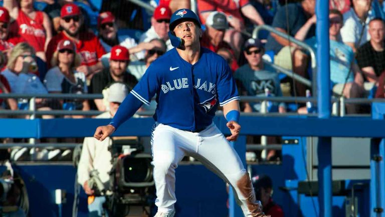 Toronto Blue Jays’ Daulton Varsho watches the ball off the bat at third base during a spring training game against the Philadelphia Phillies at TD Ballpark in Dunedin, Fla., Friday, March 24, 2023. (Mark Taylor/CP)