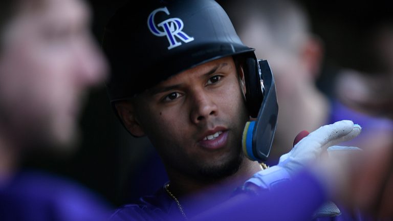 Colorado Rockies' Ezequiel Tovar celebrates with teammates in the dugout after scoring on a Brenton Doyle double during the second inning of a baseball game against the Chicago Cubs, Saturday, Sept. 23, 2023, in Chicago. Chicago won 6-3. (Paul Beaty/AP) 