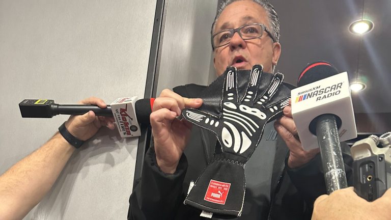 NASCAR Cup Series managing director Brad Moran shows reporters, Saturday, March 2, 2024, at Las Vegas Motor Speedway, the illegal glove Joey Logano of Team Penske was caught wearing during qualifying last week at Atlanta Motor Speedway. (AP)