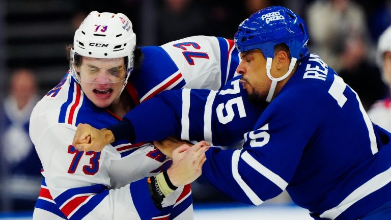 New York Rangers' Matt Rempe (73) and Toronto Maple Leafs' Ryan Reaves (75) fight during third period NHL hockey action in Toronto on Saturday, March 2, 2024. (CP)